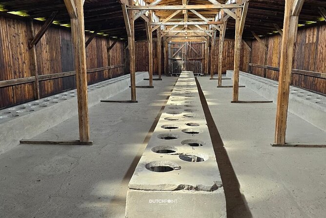 from Kraków: Auschwitz excursion with guaranteed Dutch guide - Birkenau: barracks, crematorium ruins, and the Dutch monument