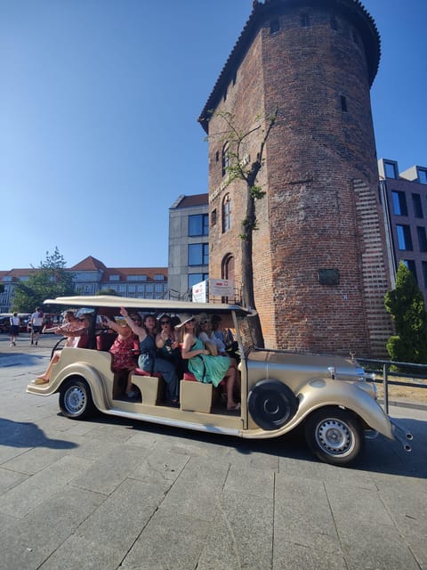 Gdansk: City Sightseeing Tour Eco Electric Buggy Golf Cart ! - What the guide and audio setup are like