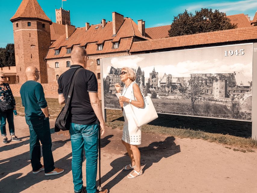 Gdansk: Malbork Castle Regular Tour - Museum rooms filled with armor, weapons, and amber
