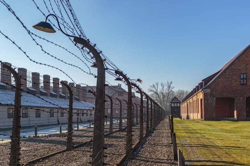 Krakow: Auschwitz-Birkenau Entry Ticket and Transfer - Entering Auschwitz I through the Arbeit Macht Frei gate