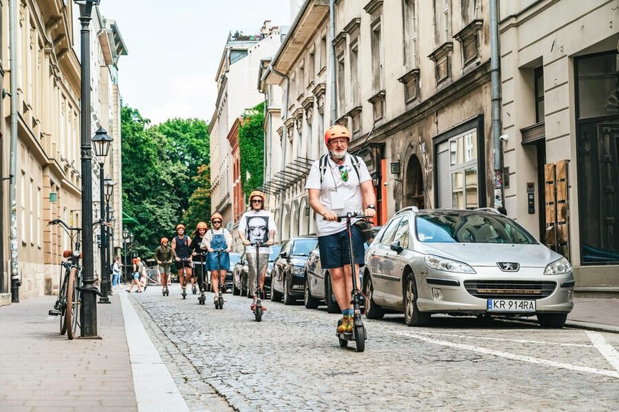 Krakow: Guided E-Scooter City Tour with Food Tastings - St. Mary’s Basilica, Florian’s Gate, and the university