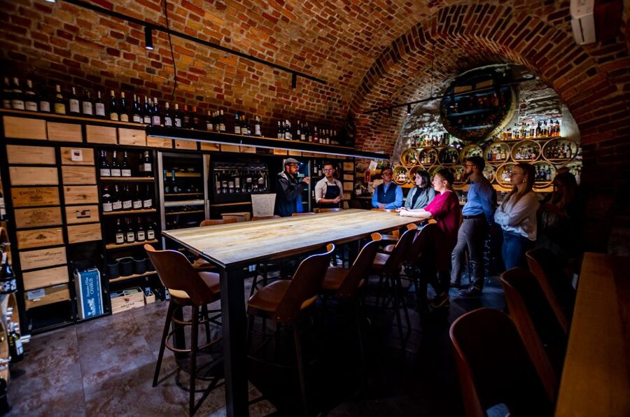 Krakow: Guided Wine Bar Tour with Tastings and Snacks - Walking through the Old Town between tastings