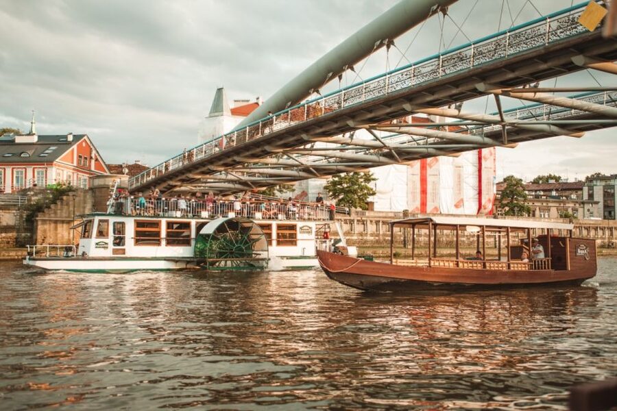 Krakow: Vistula Night Cruise by Gondola w/ Audio Commentary - A wooden gondola with a Krakow story